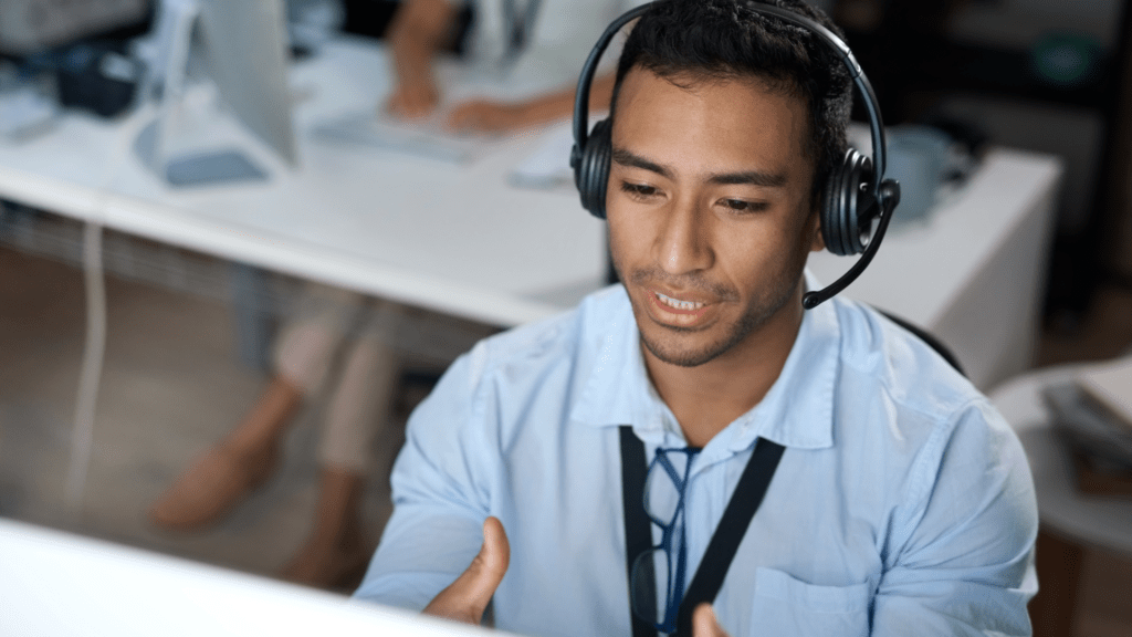 a support specialist provides help to a customer on a telephone call